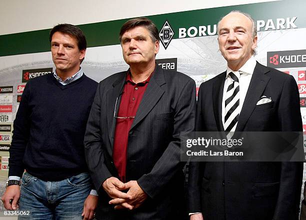 New coach Hans Meyer poses with assistant coach Christian Ziege and president Rolf Koenigs during a Borussia Moenchengladbach press conference at the...