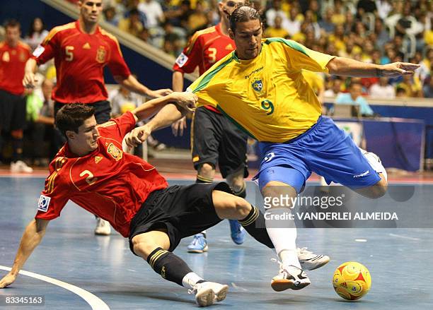 Brazil's futsal player Betao vies for the ball with Spain's Ortiz, on October 19, 2008 during their FIFA Futsal World Cup final match at...
