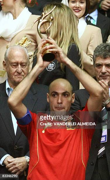 Spain's futsal player and team captain Javi Rodriguez holds the trophy for the second placed on October 19, 2008 at the end of their FIFA Futsal...