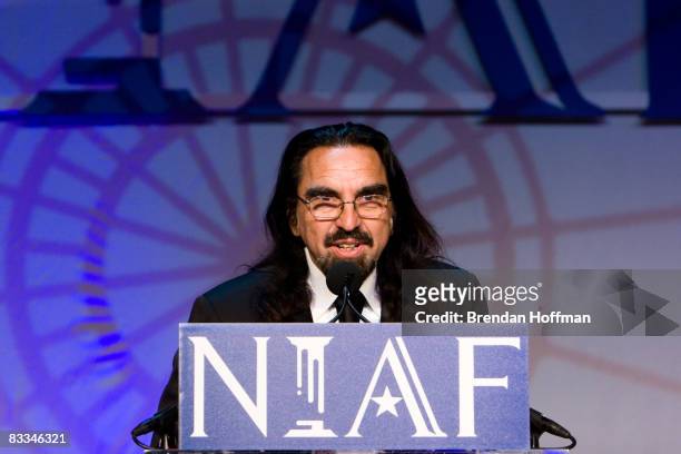 George DiCaprio, father of actor Leonardo DiCaprio, accepts a Special Achievement Award in Entertainment on his son's behalf at the National Italian...