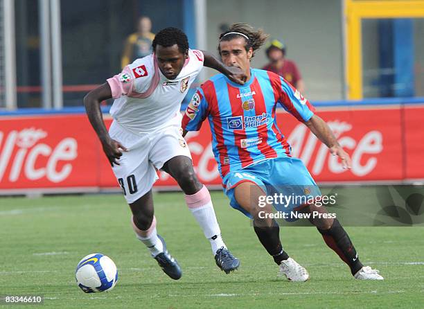 Giacomo Tedesco of Catania and Fabio Simplicio of Palermo in action during the Serie A match between Catania and Palermo at the Stadio Cibali on...