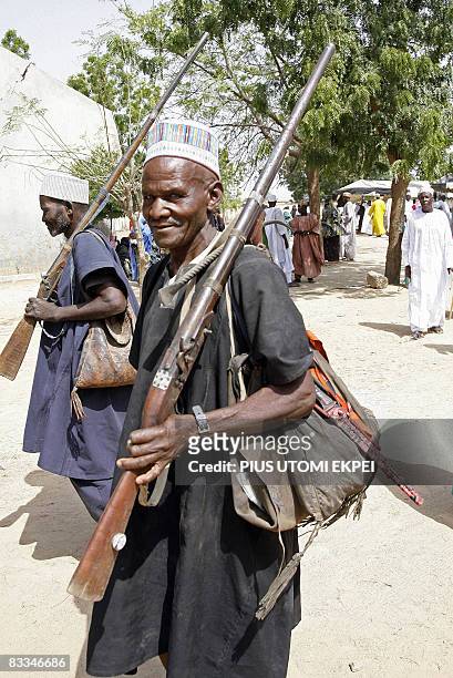 Traditional hunters arrive with dane guns to attend the Talakawa Summit in Nigeria, a meeting between locals and government officials to tackle...