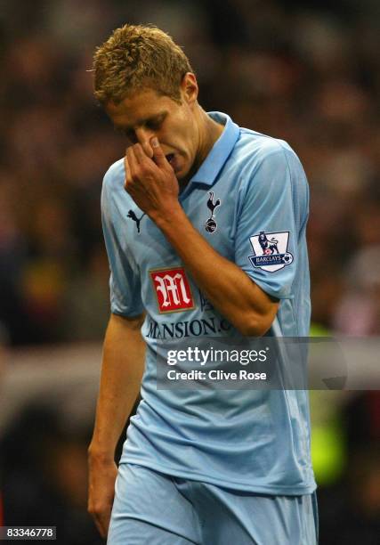 Michael Dawson of Tottenham Hotspur walks off after being shown the red card by referee Lee Mason during the Barclays Premier League match between...
