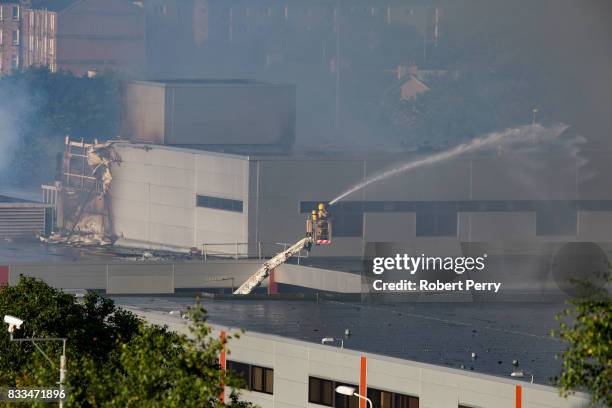 Firefighters attend the scene of a blaze at Blochairn Fruitmarket on August 17, 2017 in Glasgow. The Scottish Fire and Rescue Service are tackling a...