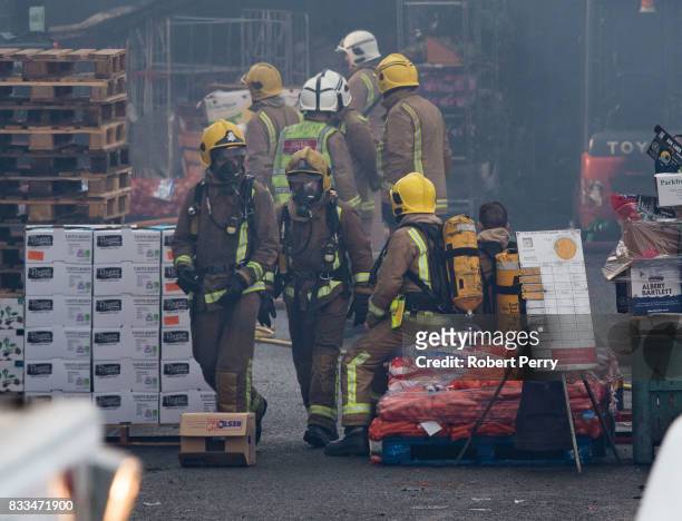 Firefighters attend the scene of a blaze at Blochairn Fruitmarket on August 17, 2017 in Glasgow. The Scottish Fire and Rescue Service are tackling a...