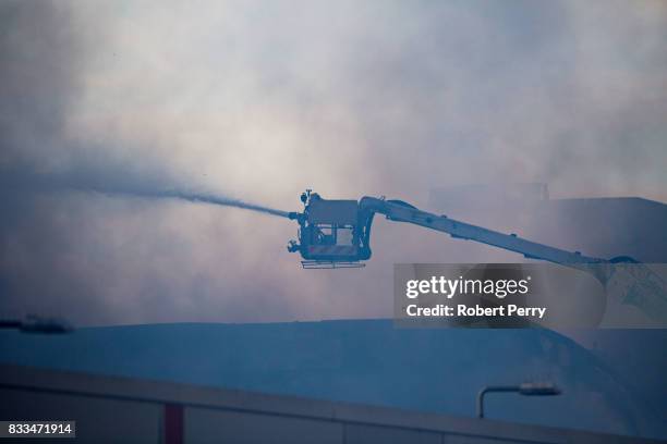 Firefighters attend the scene of a blaze at Blochairn Fruitmarket on August 17, 2017 in Glasgow. The Scottish Fire and Rescue Service are tackling a...