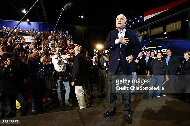 Republican presidential nominee Sen. John McCain holds his hand over his heart as a sign of thanks to the crowd during a campaign rally at the...