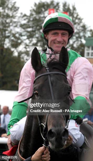 Smiling John Egan comes in after winning the first race on Dubai Dynamo at Doncaster Racecourse.