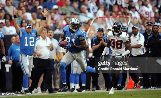 Wide receiver Calvin Johnson of the Detroit Lions makes a touchdown pass reception against DeMarcus Faggins of the Houston Texans at Reliant Stadium...