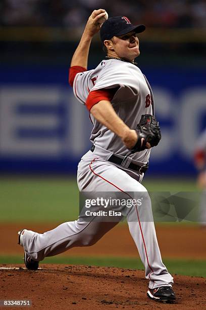 Starting pitcher Jon Lester of the Boston Red Sox delivers a pitch against the Tampa Bay Rays in game seven of the American League Championship...