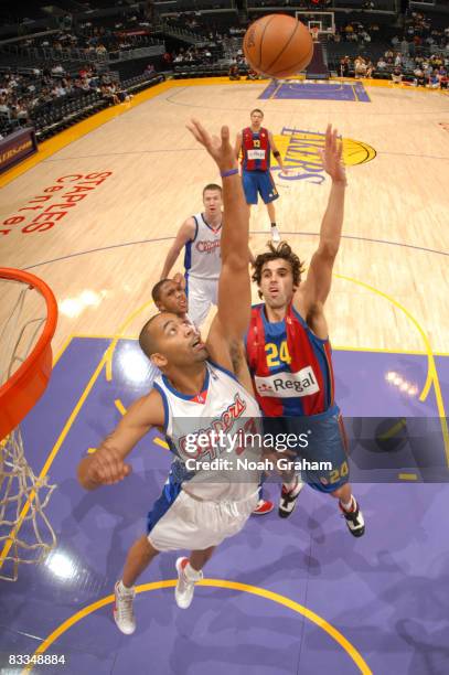 Victor Sada of Regal FC Barcelona has his shot contested by Jelani McCoy of the Los Angeles Clippers at Staples Center on October 19, 2008 in Los...