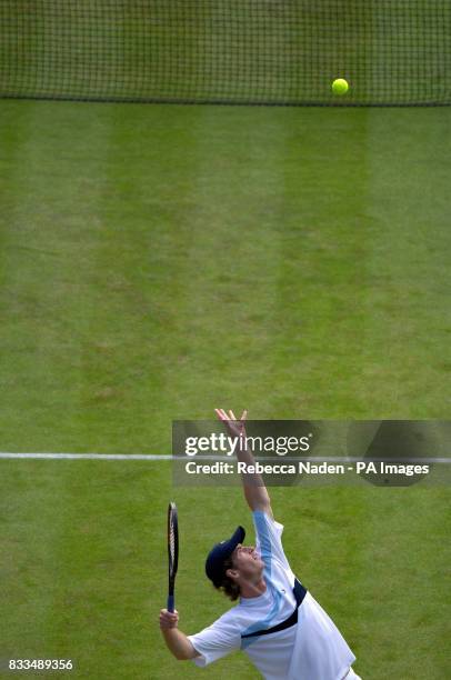 Andy Murray serves during the third day of the Davis Cup World Group Play-off at the All England Club, Wimbledon.