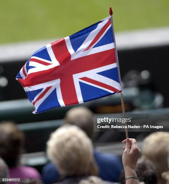 British flag is waved at Wimbledon during the third day of the Davis Cup World Group Play-off at the All England Club, Wimbledon.