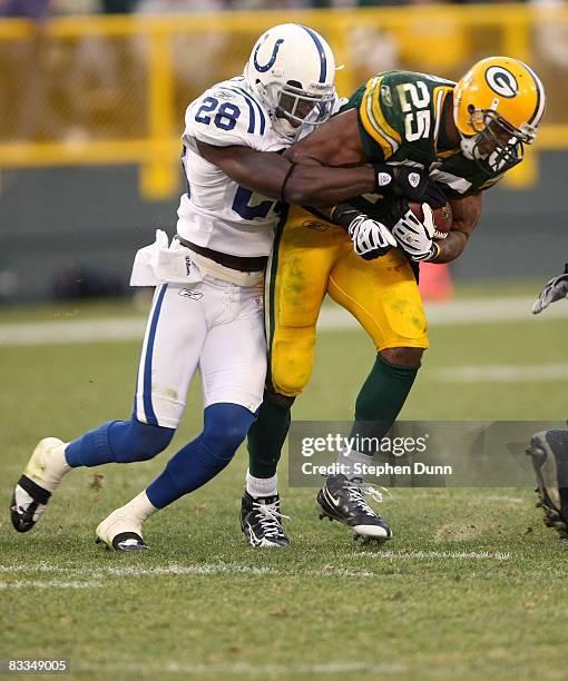 Cornerback Marlin Jackson of the Indianapolis Colts tackles running back Ryan Grant of the Green Bay Packers on October 19, 2008 at Lambeau Field in...