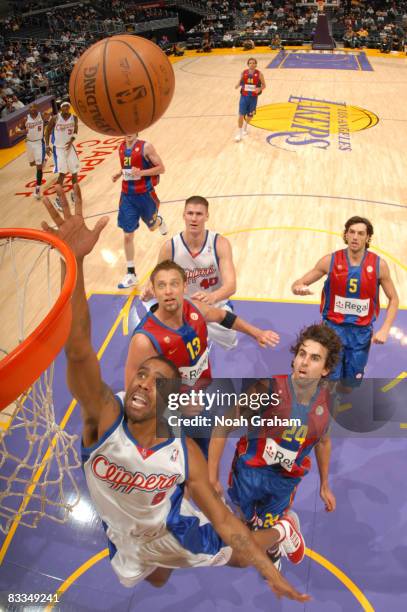 Jason Hart of the Los Angeles Clippers puts up a shot while teammate Paul Davis, and David Anderson, Victor Sada, and Gianluca Basile of Regal FC...