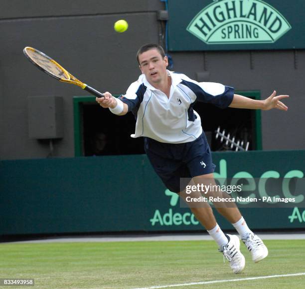 Jamie Baker in action during the third day of the Davis Cup World Group Play-off at the All England Club, Wimbledon.