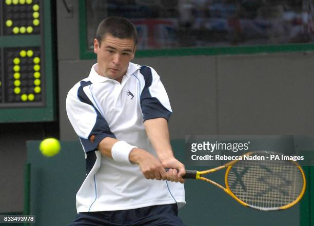 Jamie Baker in action during the third day of the Davis Cup World Group Play-off at the All England Club, Wimbledon.