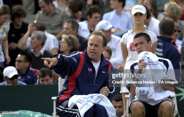 Great Britain's John Lloyd gives advice to Jamie Baker during the third day of the Davis Cup World Group Play-off at the All England Club, Wimbledon.