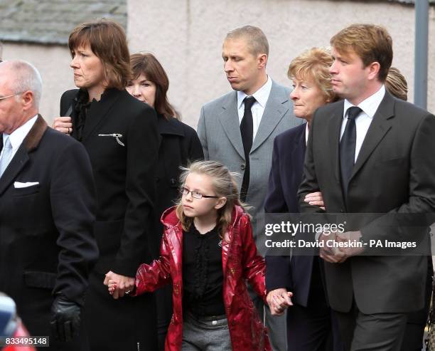 Colin McRae's widow Alison McRae , her daughter Hollie , and Colin McRae's brother Jimmy arrive for the funeral of Ben Porcelli, who died in a...