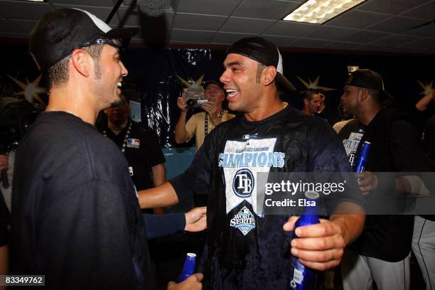 Carlos Pena and Jason Bartlett of the Tampa Bay Rays celebrates after defeating the Boston Red Sox in game seven of the American League Championship...