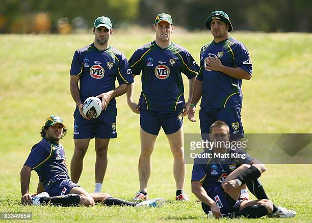 Johnathan Thurston, Cameron Smith, Brent Tate, Steve Price and Scott Prince of the Kangaroos warm up during an Australian Kangaroos training session...