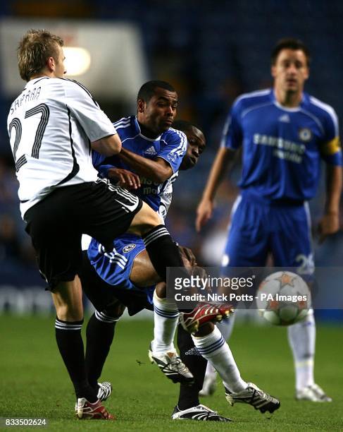 Rosenborg's Marek Sapara and Yssouf Kone combine to deny Chelsea's Ashley Cole