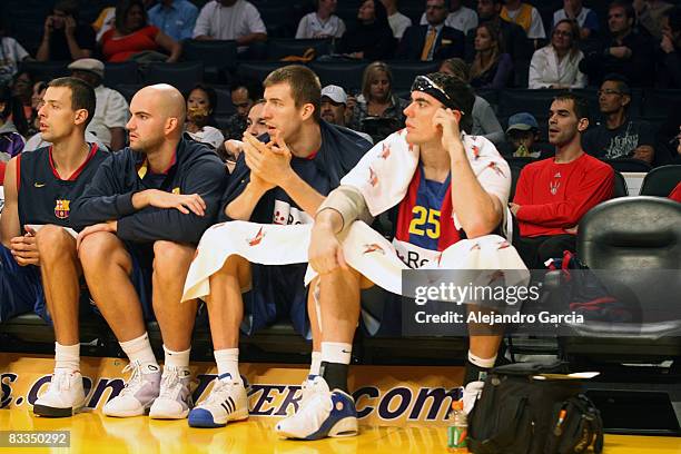 Of Regal FC Barcelona, Victor Sada, #14 Xavi Rey, #17 Fran Vazquez and Daniel Santiago on bench during the Euroleague Basketball American Tour match...