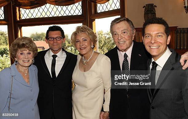 Shirley Livingston, Ginny Mancini, Tony Martin attend the wedding of Michael Feinstein and Terrence Flannery held at a private residence on October...