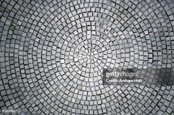 abstract background of stone paving circle - adoquinado fotografías e imágenes de stock
