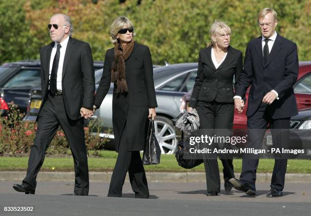 Dave Richards and Ari Vatanen arrive with their partners for the funeral of Colin McRae and son Johnny at East Chapel, Daldowie Crematorium.