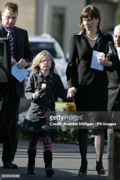 Alison McRae and daughter Holly leave the funeral of Colin McRae and son Johnny at East Chapel, Daldowie Crematorium.