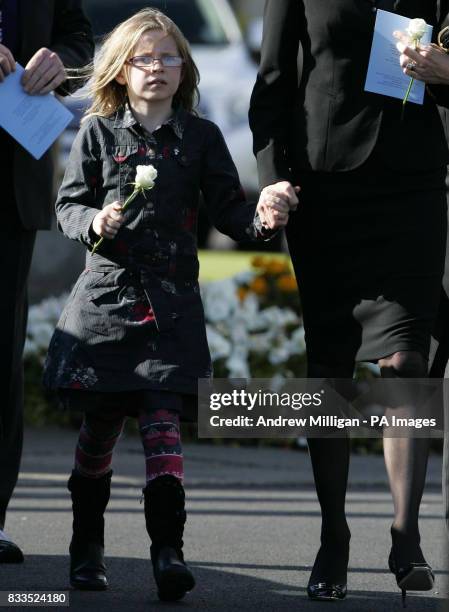 Alison McRae and daughter Holly leave the funeral of Colin McRae and son Johnny at East Chapel, Daldowie Crematorium.