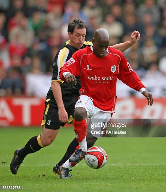 Barnsley's Jamal Campbell-Ryce takes on Cardiff City's Robbie Fowler during the Coca-Cola Football League Championship match at the Oakwell Ground,...