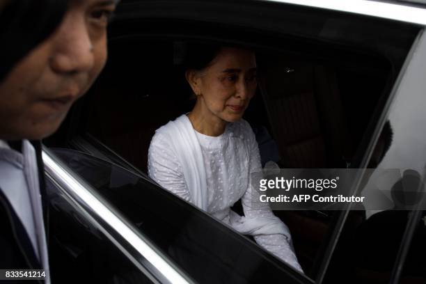 Myanmar's State Counselor Aung San Suu Kyi leaves after attending the funeral service for the National League for Democracy party's former chairman...