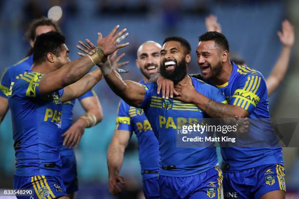 Michael Jennings of the Eels celebrates with team mates after scoring a try that was subsequently disallowed during the round 24 NRL match between...