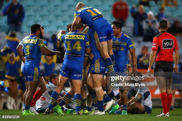 The Eels celebrate the try scored by Will Smith during the round 24 NRL match between the Parramatta Eels and the Gold Coast Titans at ANZ Stadium on...