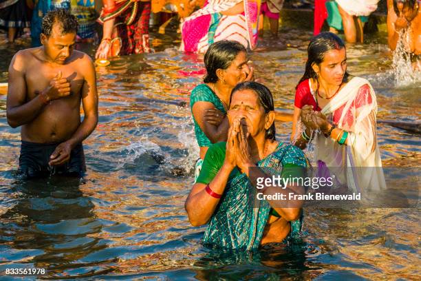 Pilgrims are taking bath in the holy river Ganges at Dashashwamedh Ghat, Main Ghat, in the suburb Godowlia.