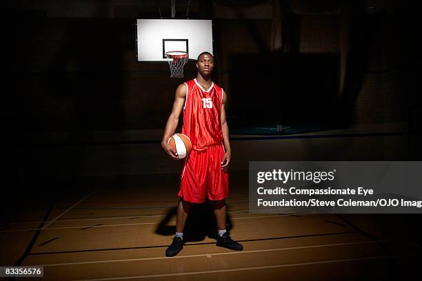 portrait of a young man on the basketball court - basketball player ストックフォトと画像
