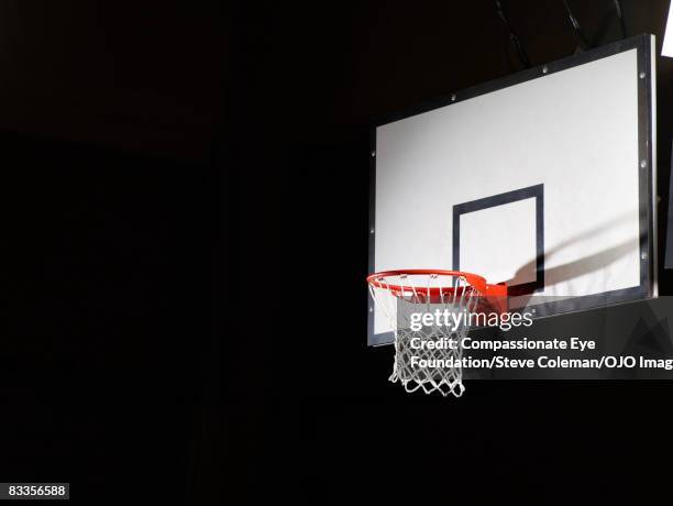 basketball board against a black background - canestro da pallacanestro foto e immagini stock
