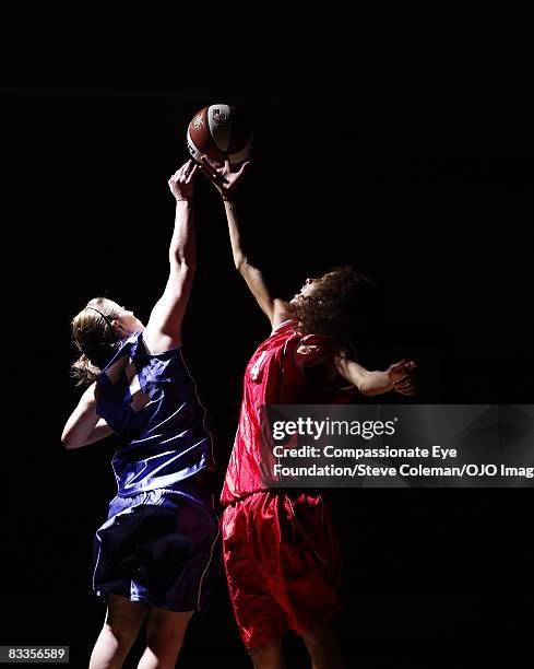 two young women jumping for the ball - snatch weightlifting stock pictures, royalty-free photos & images