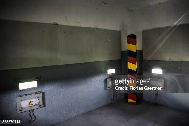 Boundary post in the colors of the german flag is place in a watchtower near the former inner-German border on August 15, 2017 in Hoyersburg, Germany.