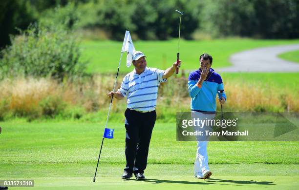 Michael Watson of Wessex Golf Centre and Richard O'Hanlon of St Kew Golf Club celebrate finishing their second round 9 under par during the...