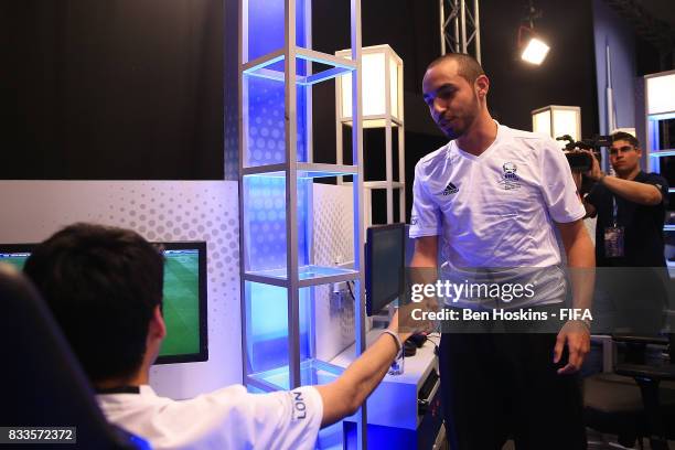 Mohammed "Mo_Aubameyang" Harkous of Germany shakes hands with his oppenent after winning his quarter final match against Gonzalo "Nicolas99FC"...