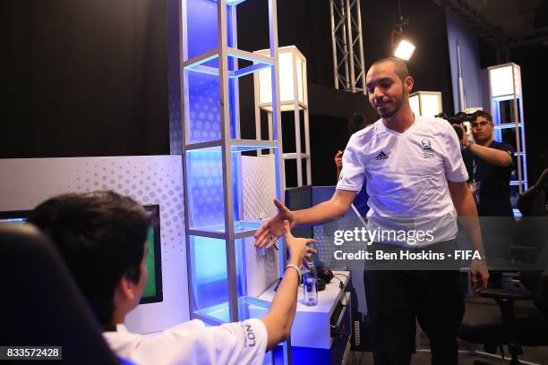 Mohammed "Mo_Aubameyang" Harkous of Germany shakes hands with his oppenent after winning his quarter final match against Gonzalo "Nicolas99FC"...