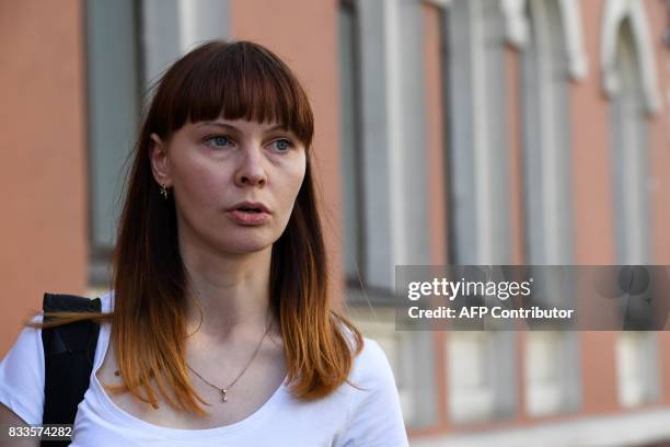 Darya Sukhikh, a lawyer for Raoul Wallenberg's relatives, speaks with journalists outside Moscow's Meshchansky district court on August 17, 2017....