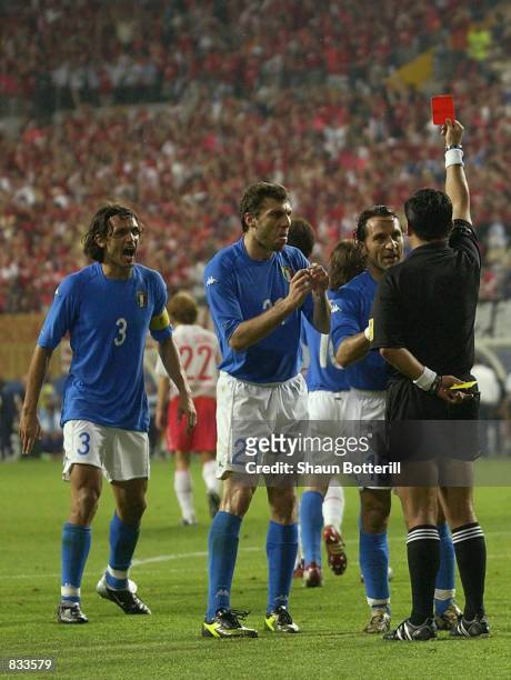 Italian players react to referee Byron Moreno of Ecuador decision to send off Francesco Totti of Italy during the FIFA World Cup Finals 2002 Second...