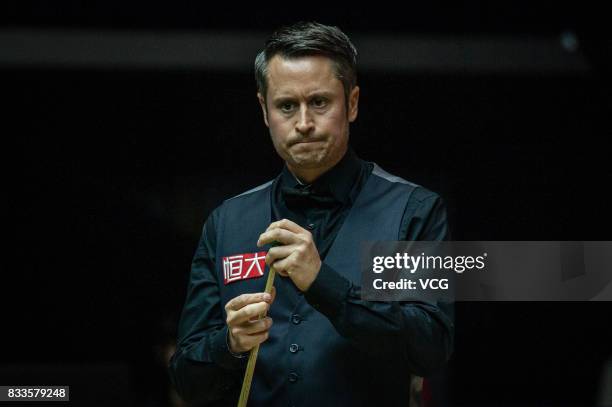 Alfie Burden of England reacts during his first round match against Ding Junhui of China on day two of Evergrande 2017 World Snooker China Champion...