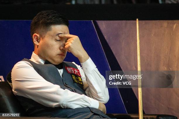 Ding Junhui of China reacts during his first round match against Alfie Burden of England on day two of Evergrande 2017 World Snooker China Champion...