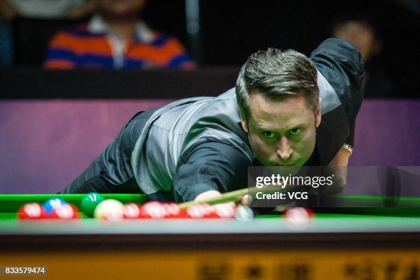 Alfie Burden of England plays a shot during his first round match against Ding Junhui of China on day two of Evergrande 2017 World Snooker China...