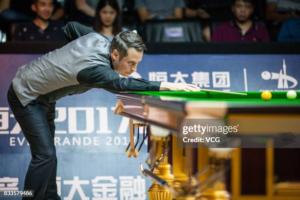 Alfie Burden of England plays a shot during his first round match against Ding Junhui of China on day two of Evergrande 2017 World Snooker China...